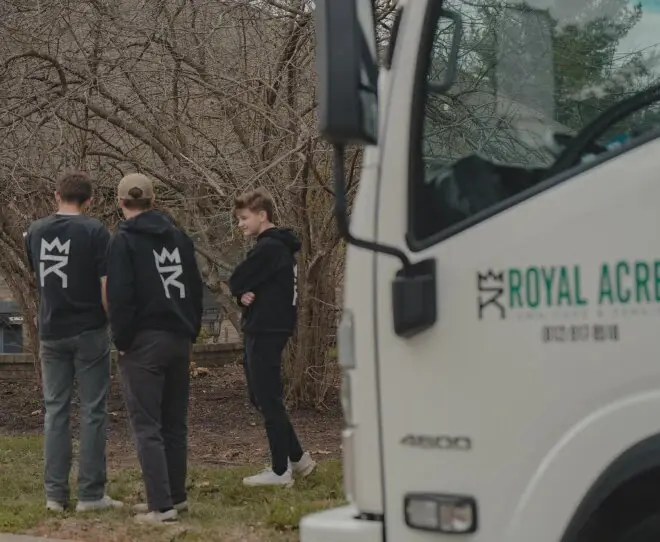 Three of the Royal Acres crew beside the company truck