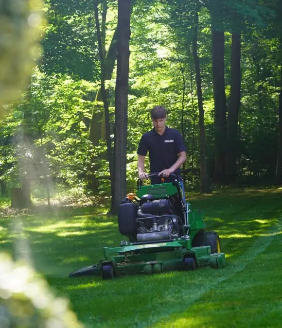 A Royal Acres crew mowing
