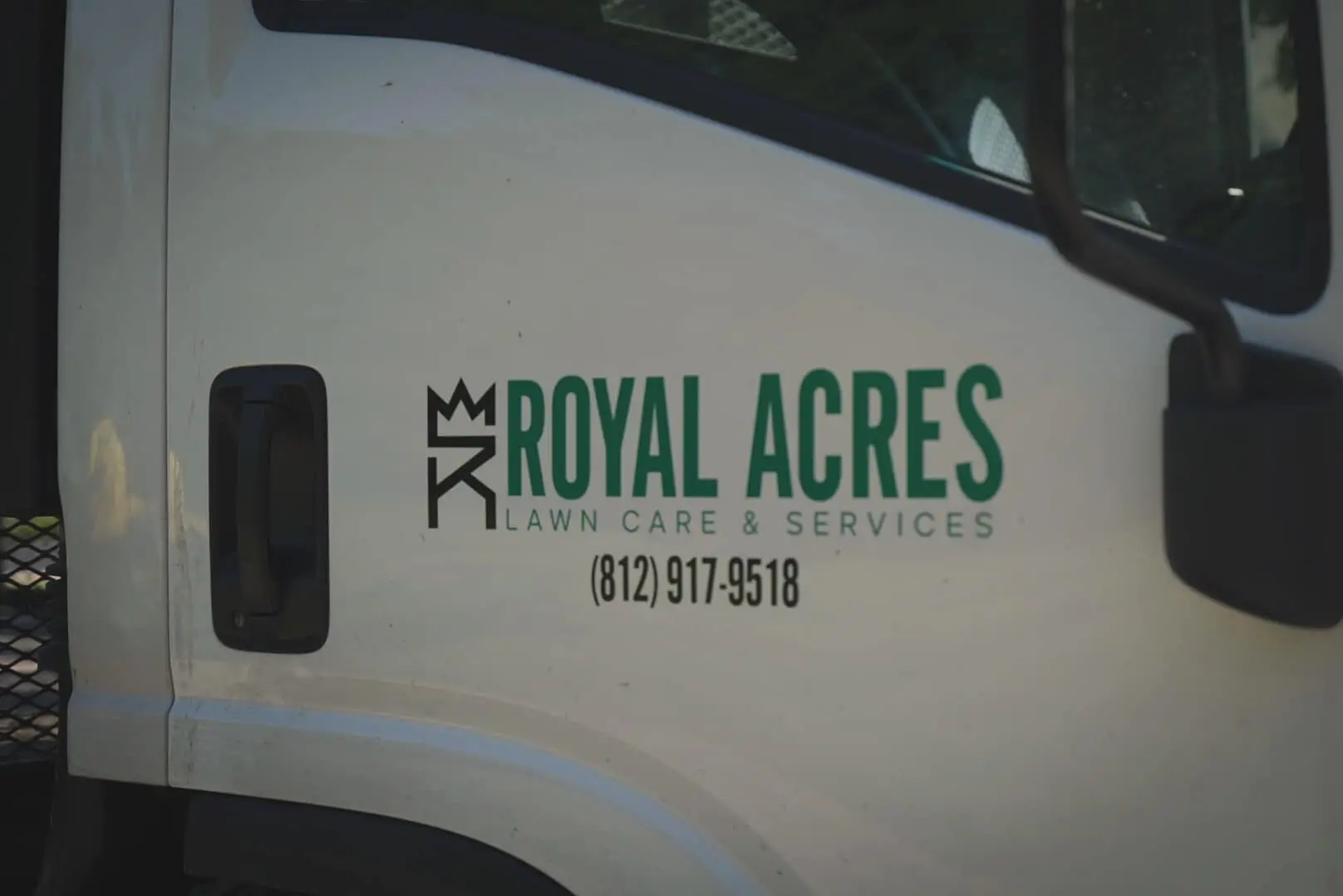 The Royal Acres logo on the truck door